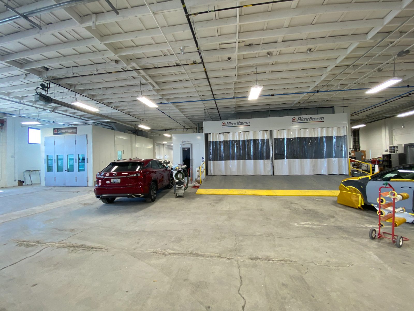 New paint booths and prep stations inside the working shop