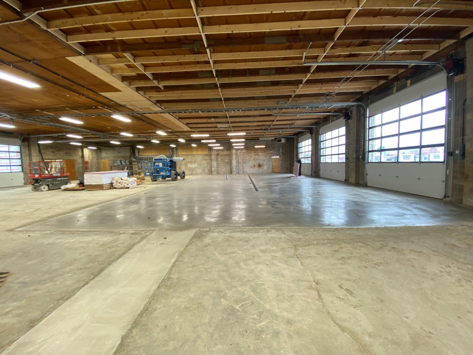 Warehouse shell gutted to the block with new bay doors and fresh slab