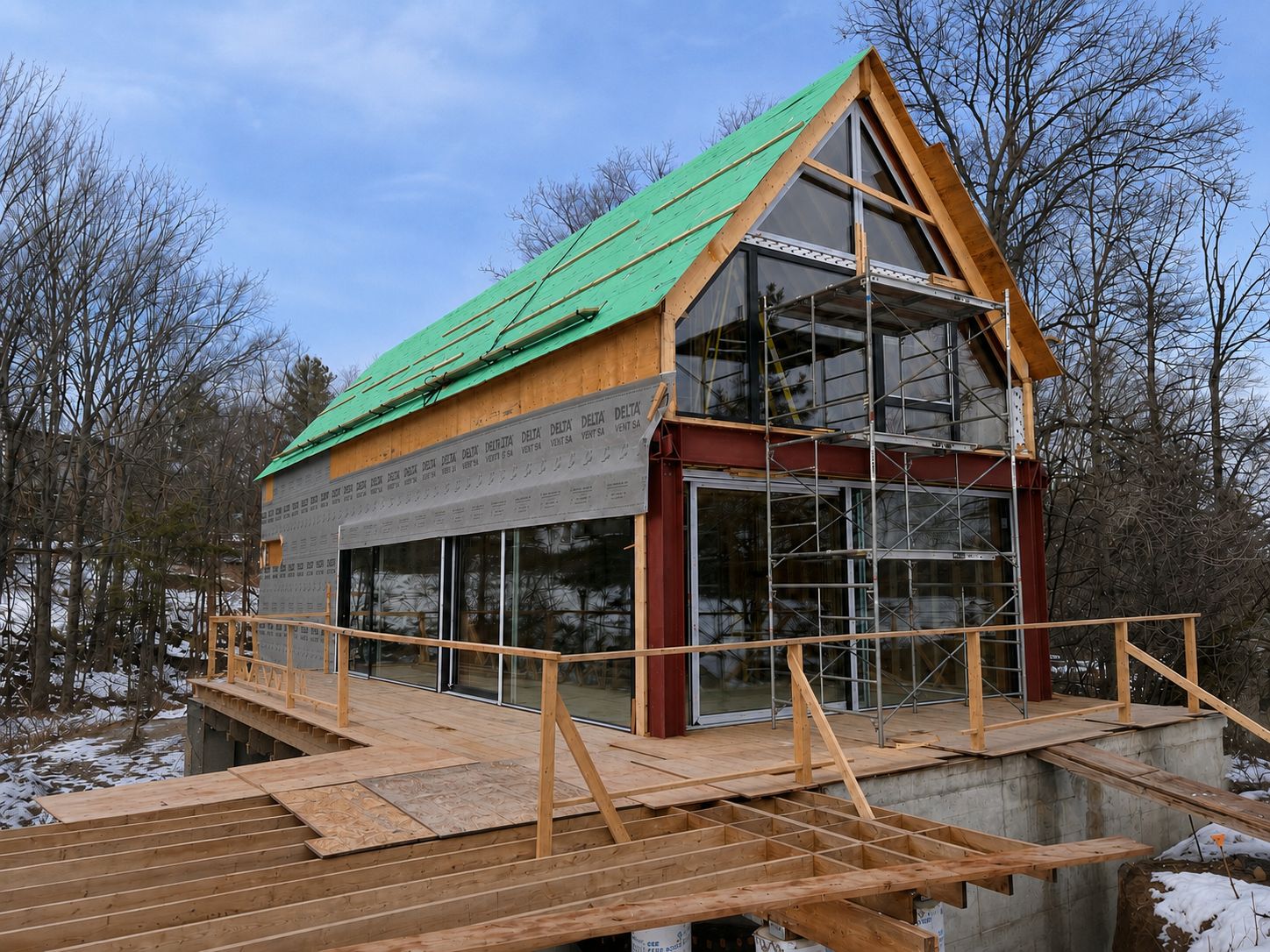 Steel and timber frame with glazing and taped envelope wrap