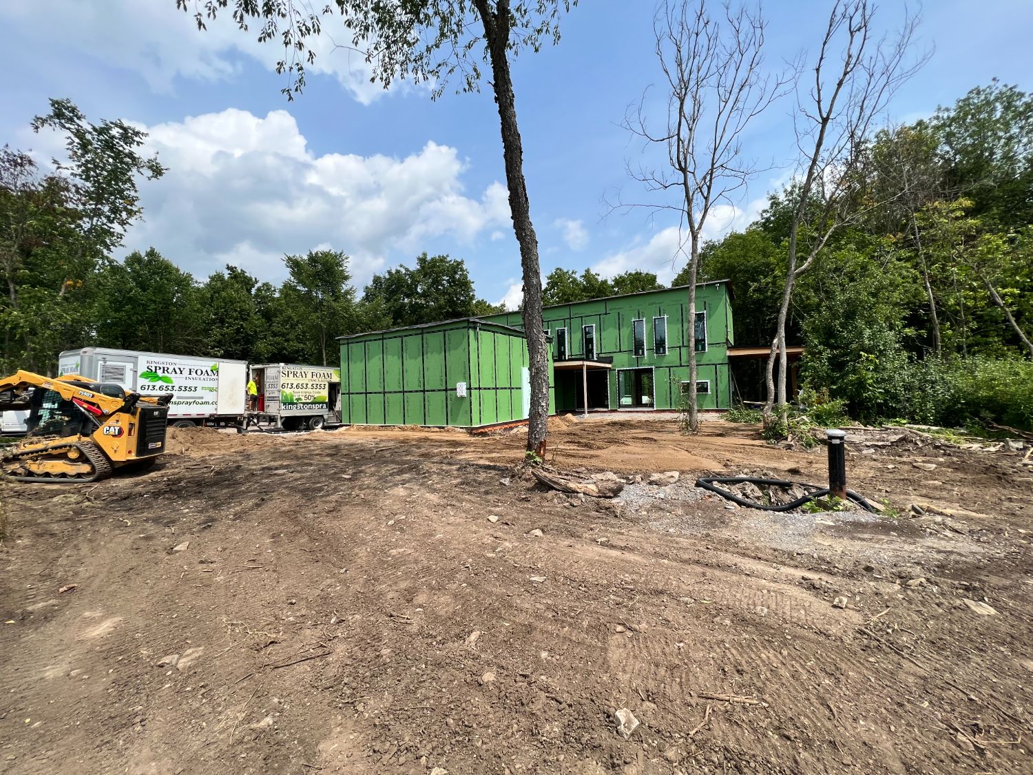 House wrapped in green ZIP System structural sheathing