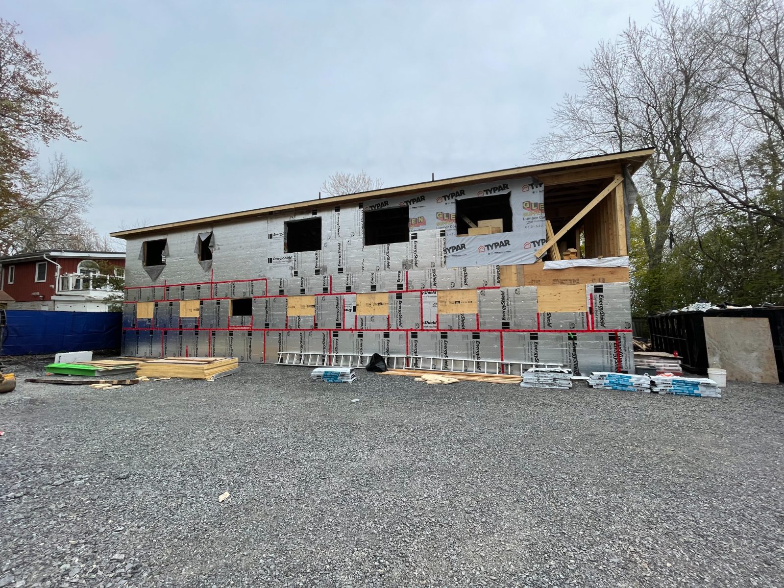 Addition wrapped in continuous exterior insulation with taped seams