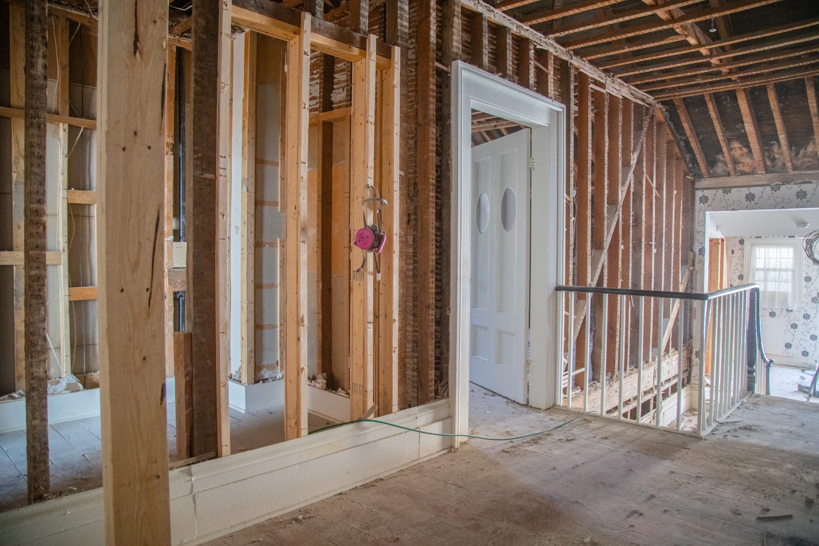 Heritage house gutted to the studs, original stair and trim preserved
