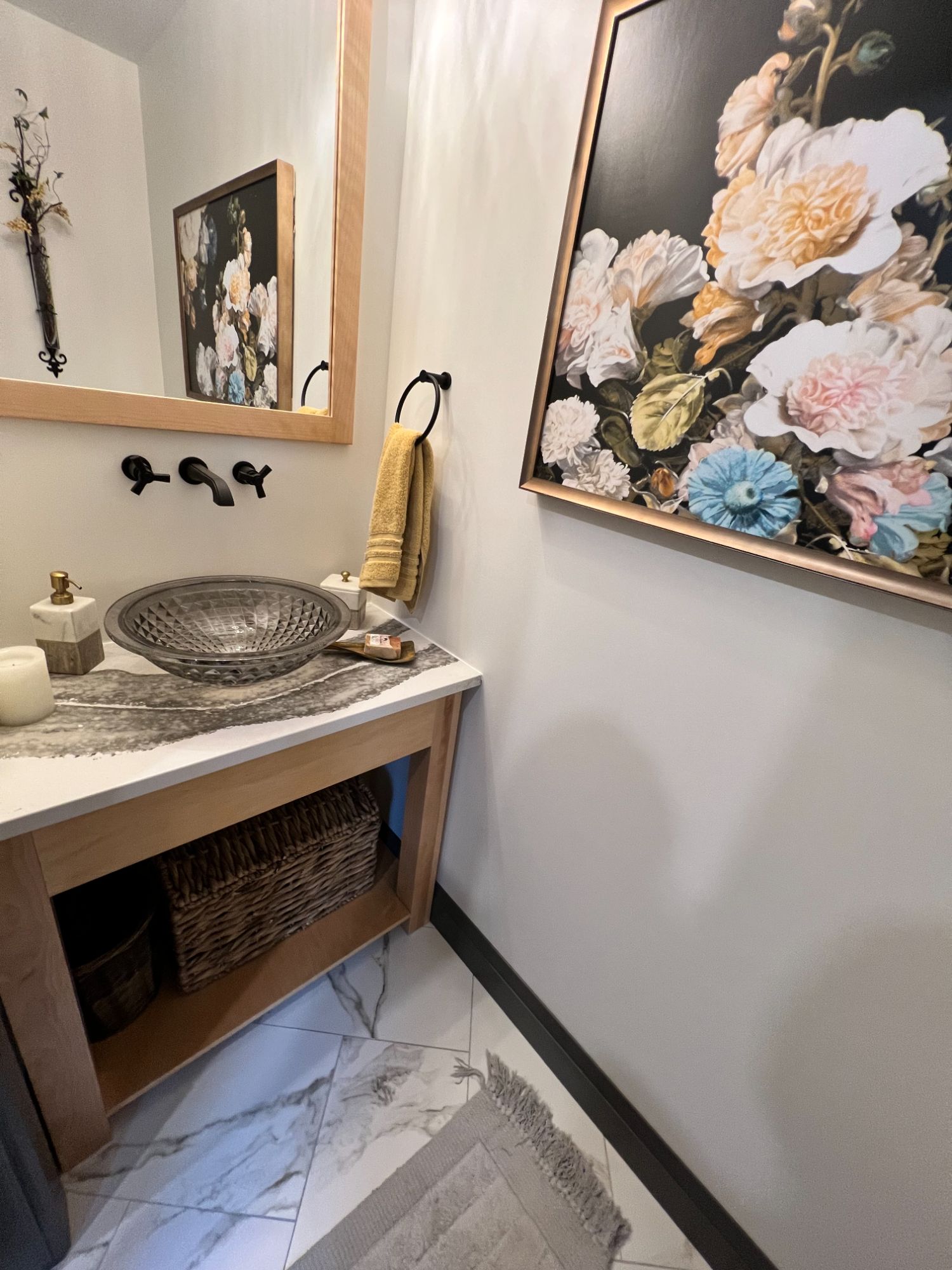 Powder room with live-edge vanity, glass vessel sink and floral art