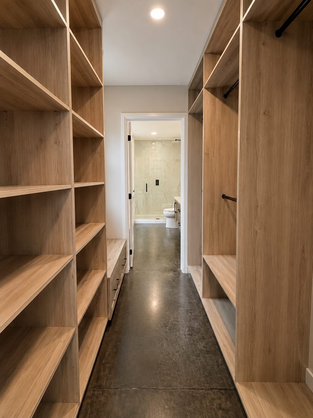 White-oak walk-in closet leading to the ensuite
